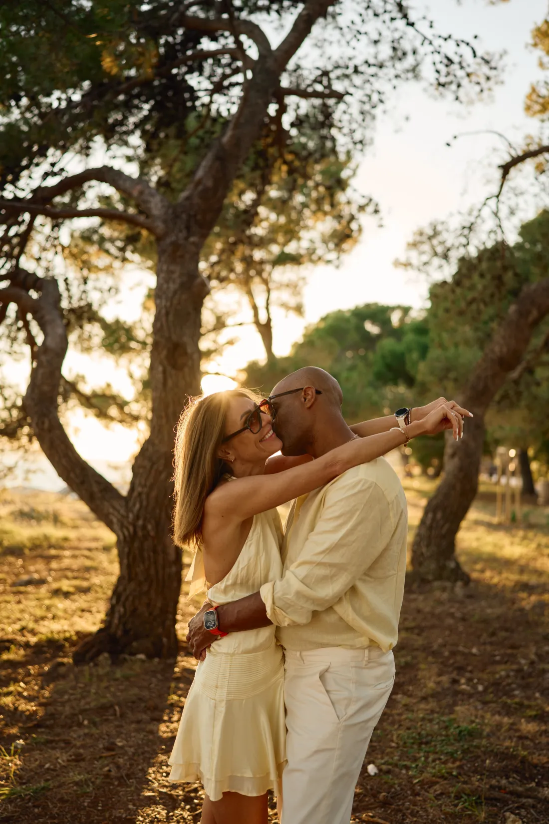 Couple under the pine trees by the Adriatic after their proposal