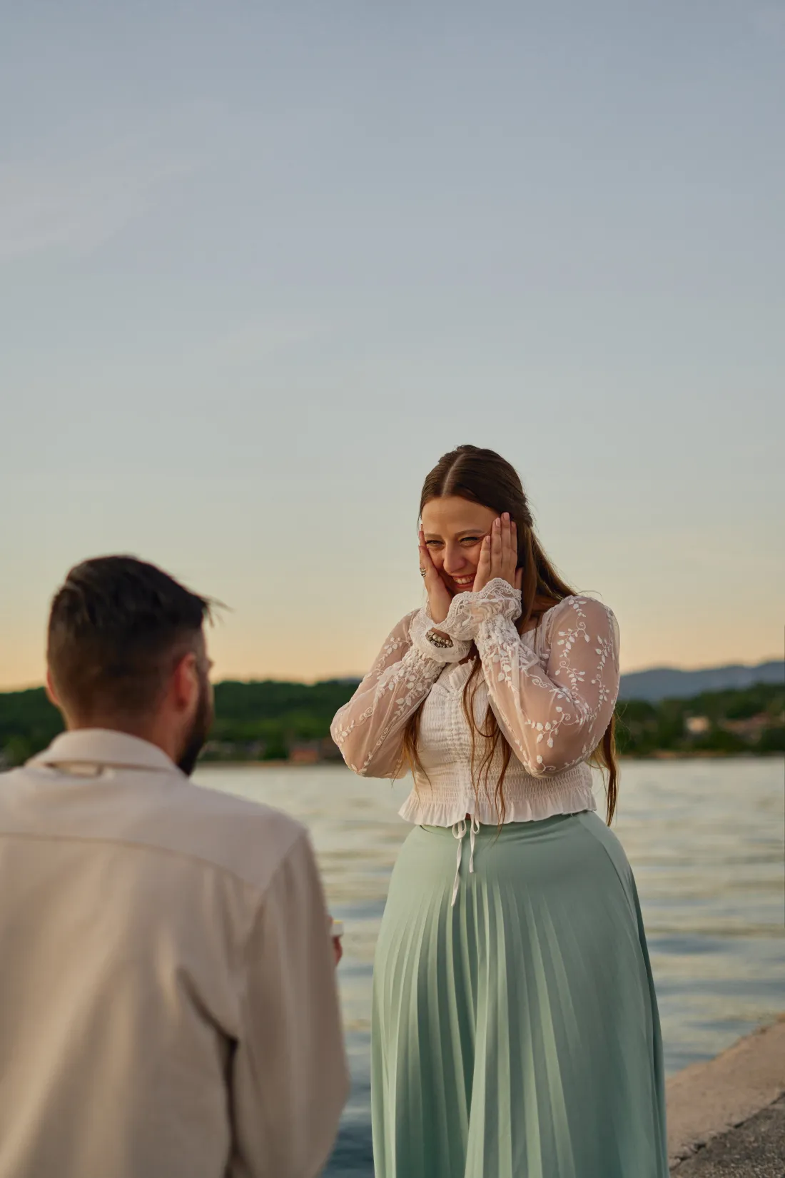 Polaroid photo of a woman's overwhelmed reaction the moment she realises it's a proposal