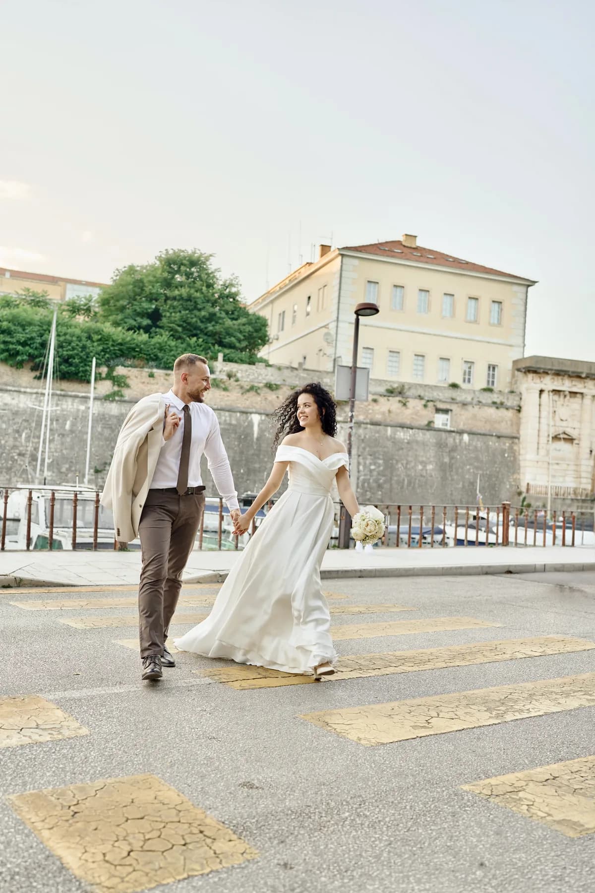 Couple crossing a street in the old town