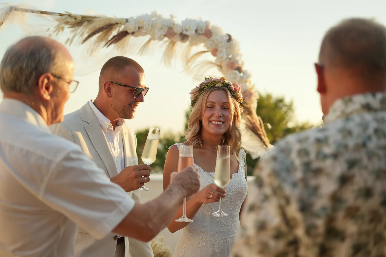 Guests raising a toast with the newlyweds