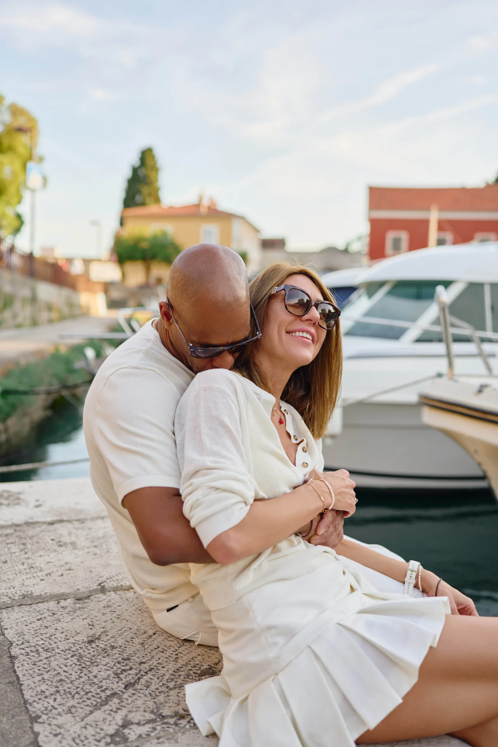 Couple laughing together by the harbor in Zadar