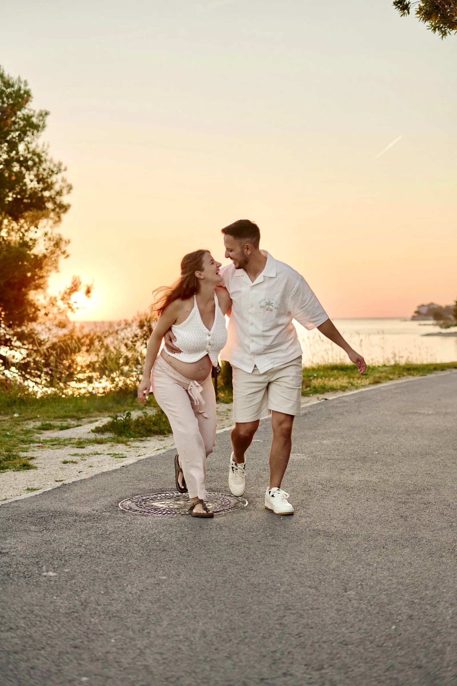 Couple walking together at sunset near the Adriatic
